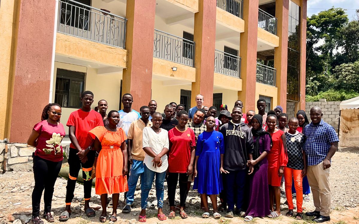 Members of the community outside the new family life center next to the Kiteezi dumpsite in Uganda.