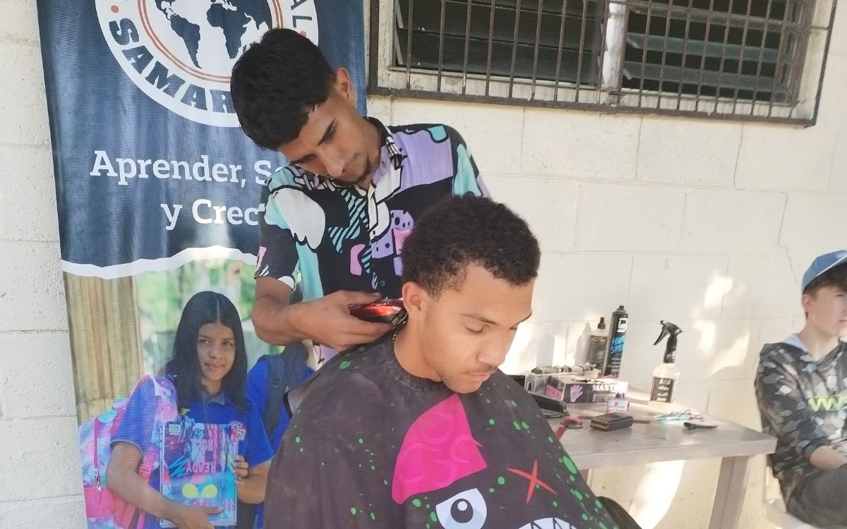 BLOG - author & photos (6) Anthony giving haircuts