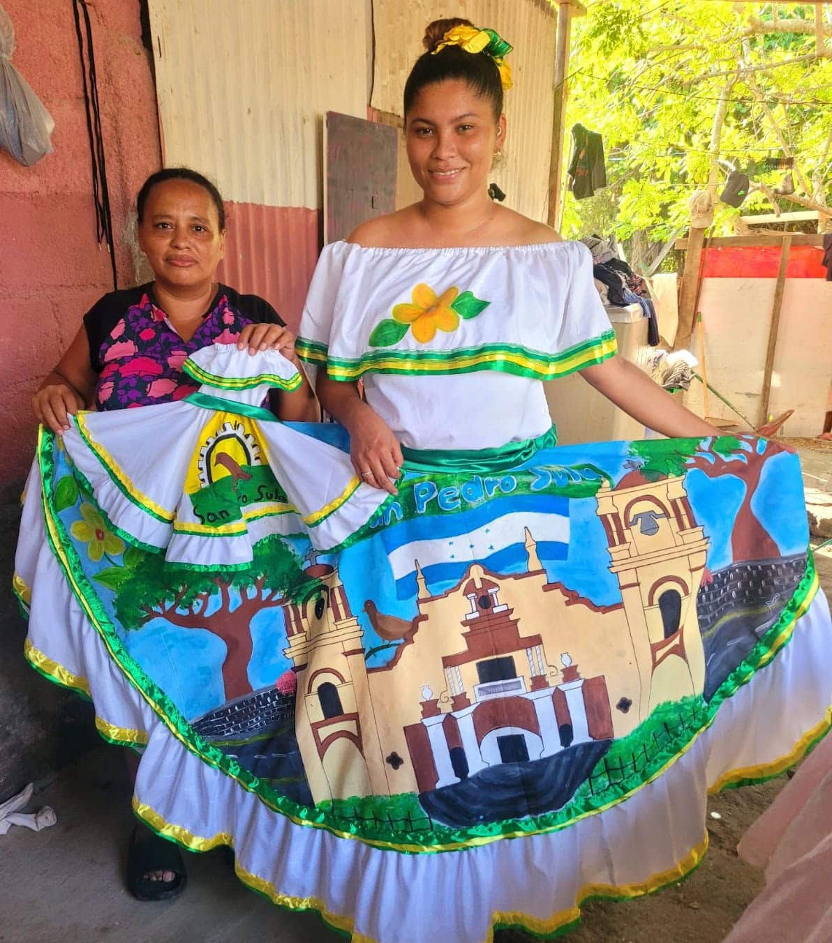 A scholar is modeling the dress that Lorena made for the auction.
