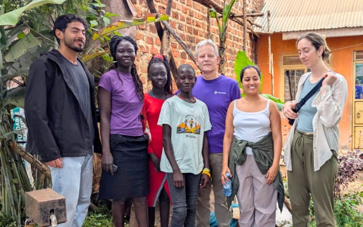 Trinity Health Michigan doctors visiting a scholar and her family.
