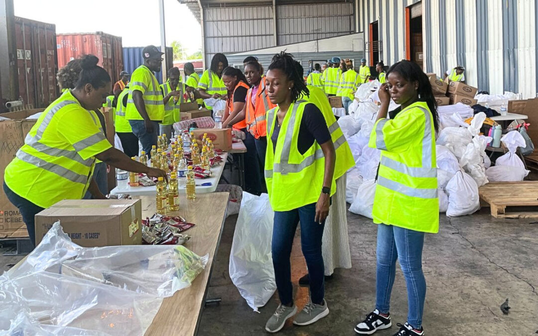 Volunteers in Jamaica assemble care packages for victims of Hurricane Melissa.