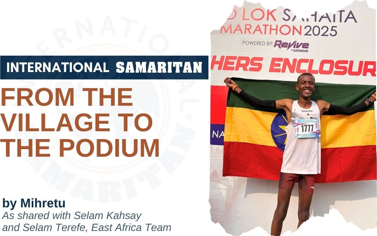 From the Village to the Podium heading with photo of Mihretu with flag.