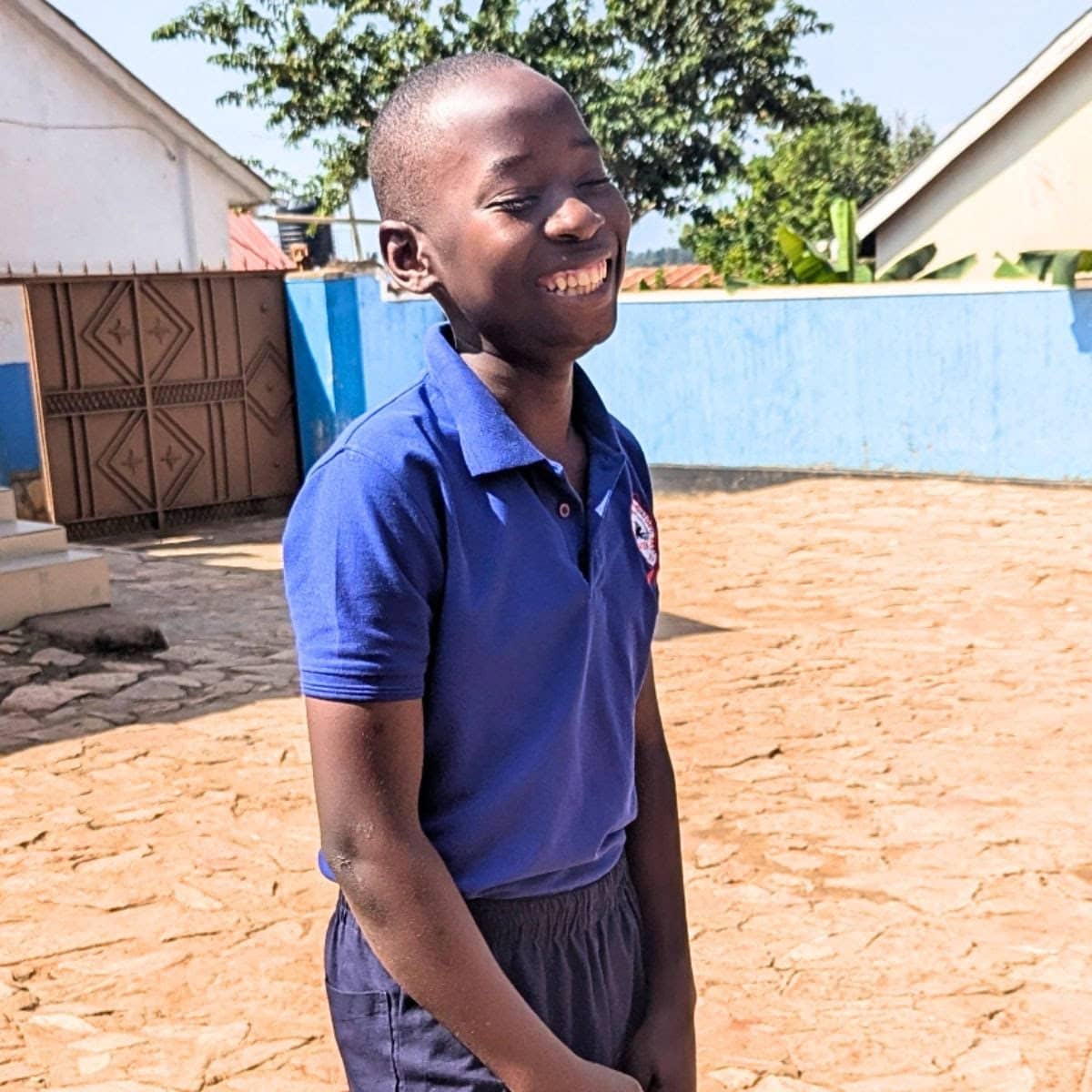 Child standing in courtyard