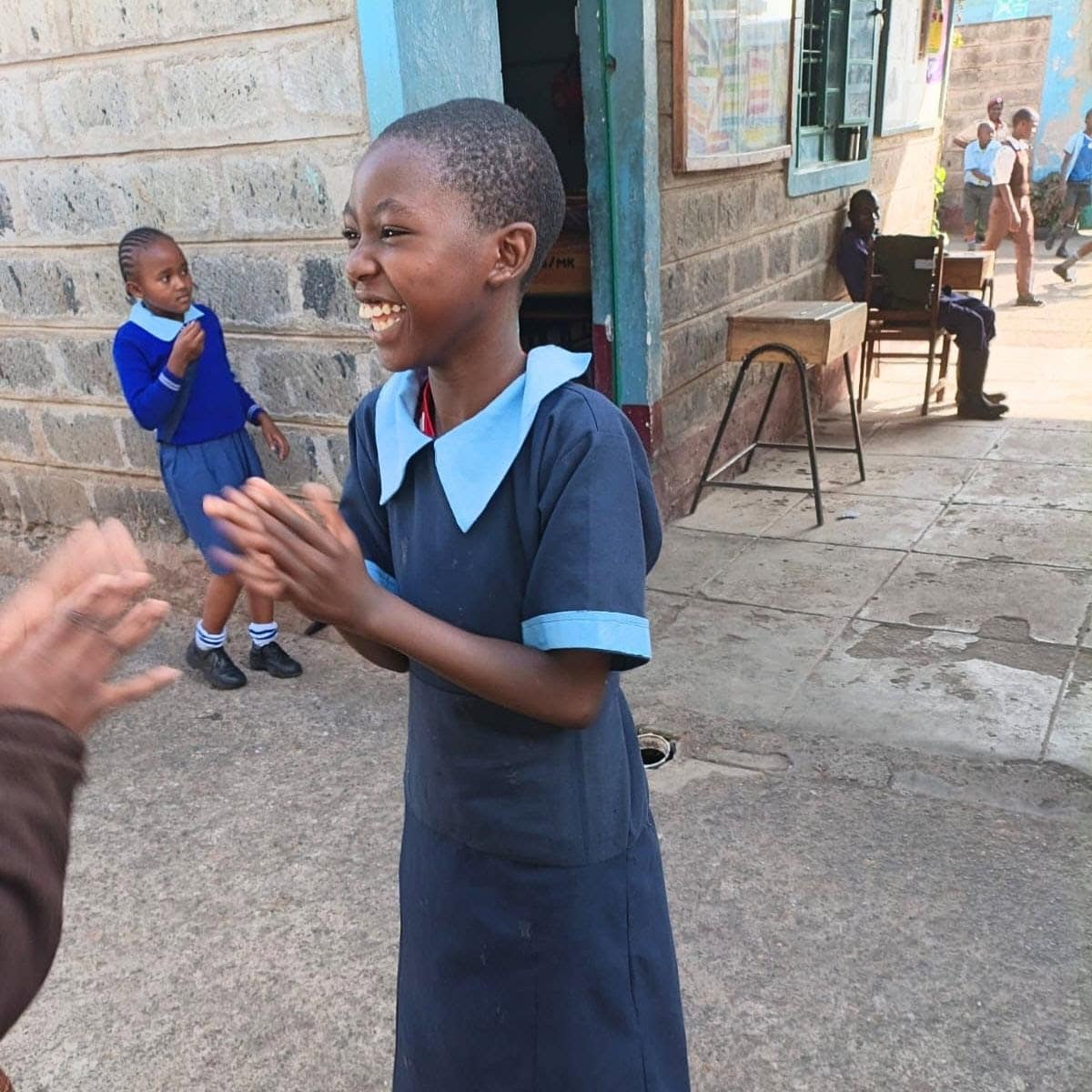 Members of the community outside the new family life center next to the Kiteezi dumpsite in Uganda.