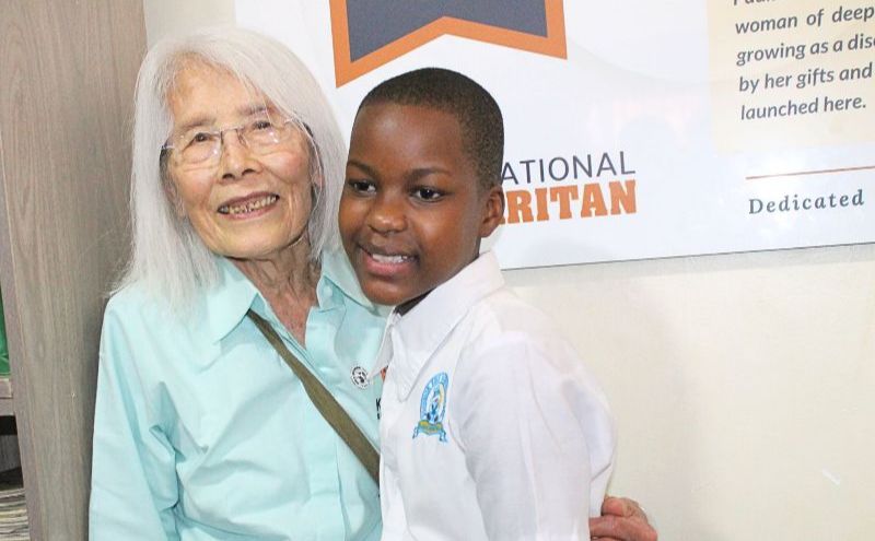 Pauline Beh and a scholar.